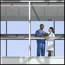 healthcare workers talking in hallway