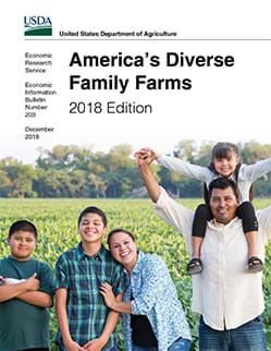 Farm family by corn field, smiling, portrait